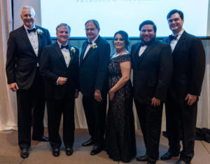 Stephens, third from left, is joined by staff members of the PBPA: Scott Kidwell, Ben Shepperd, Jamie Ramirez, Michael Lozano, and Stephen Robertson.